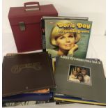 A collection of assorted vintage vinyl LP's and box sets together with a red record case.