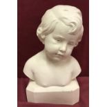 A white marble style bust of a child, signed to side D.David.