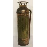 A vintage copper and brass 2½ gallon fire extinguisher with rubber hose.