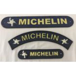 3 painted cast metal wall hanging Michelin plaques with fixing holes.