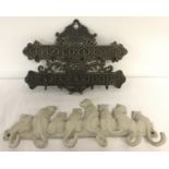 2 cast metal wall hanging hooks. A bronzed effect key hook.