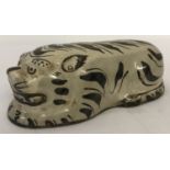 A Chinese hand painted ceramic miniature pillow in the shape of a tiger.