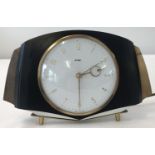 A vintage electric Metamec mantel clock.