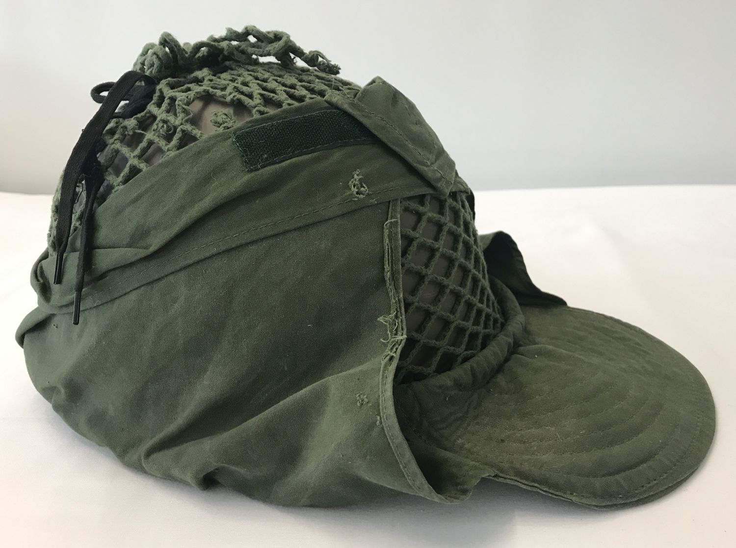 A 1937 pattern Swedish helmet with canvas and string peaked cover.