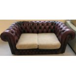A Thomas Lloyd Ox blood red leather, 2 seater, Chesterfield settee.