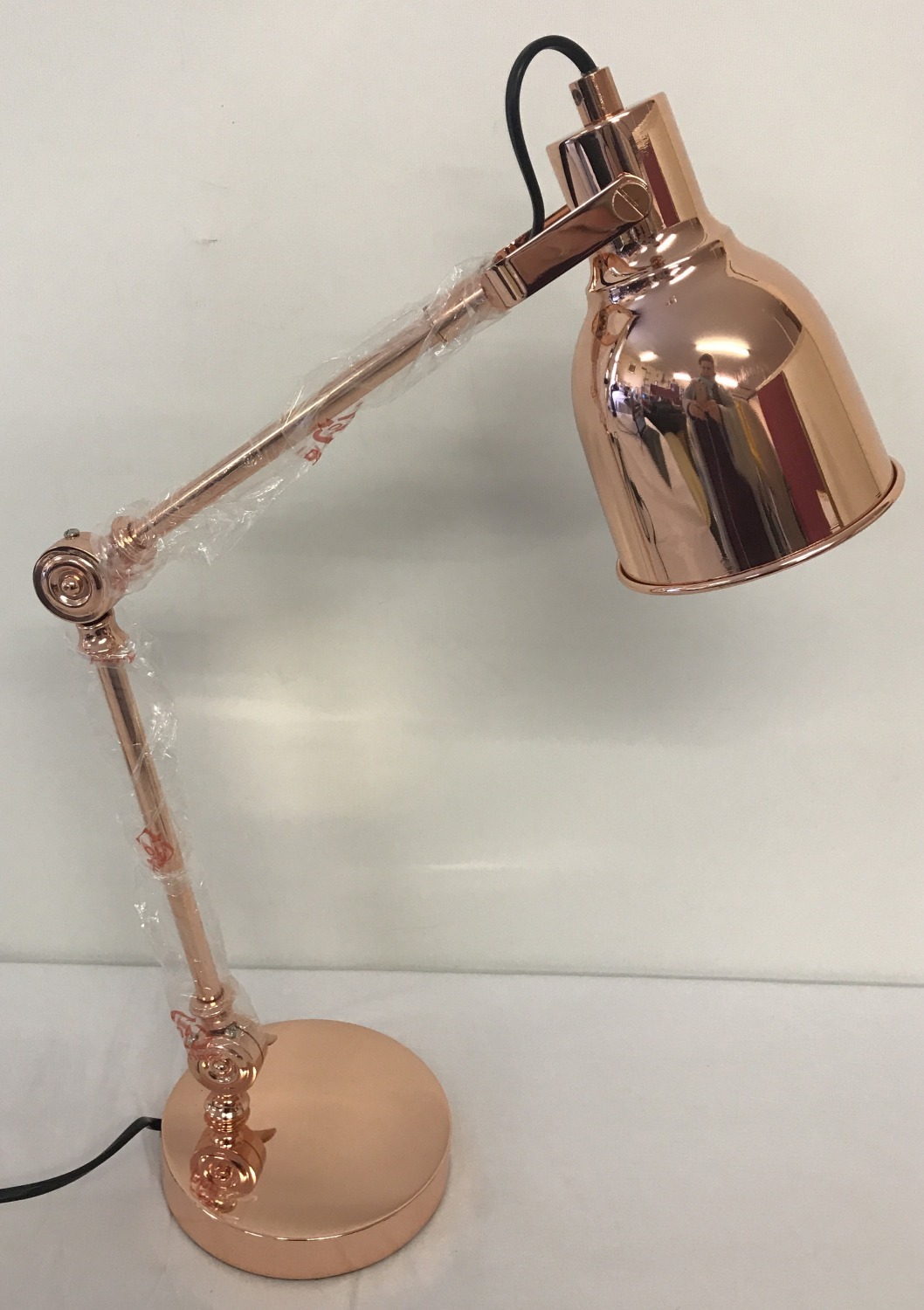 A new and boxed copper angle poise style desk lamp.