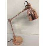 A new and boxed copper angle poise style desk lamp.