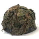 A Belgian Army OTAN M1951 steel helmet, US M1 style, circa 1985. With net and scrim.