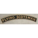 A large curve shaped cast metal Flying Scotsman wall hanging sign with fixing holes.