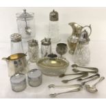 A box of vintage glass and silver plate ware. To include sugar sifters, condiment jars & sugar tongs