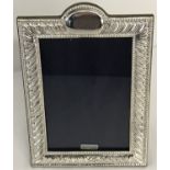 A 925 silver photo frame, hallmarked London 2018, with blank cartouche to top of frame.