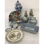 A collection of oriental ceramics. To include a ginger jar, sake carafe and cups and rice bowls.