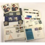 A collection of first day covers together with 2 commemorative Charles and Diana wedding coins