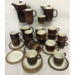 A quantity of vintage brown and cream glaze Poole pottery coffee and tea ware.