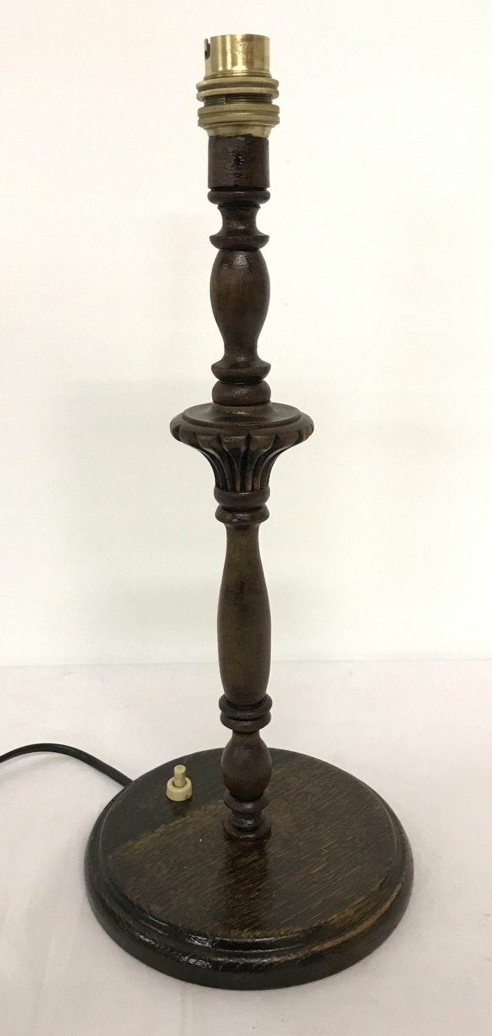 A vintage turned and carved wood table lamp.