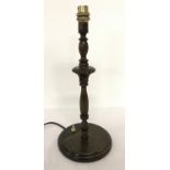 A vintage turned and carved wood table lamp.