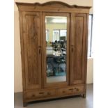 A vintage pine 3 door 2 drawer wardrobe.