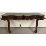 A Victorian Mahogany wall mountable table/shelf with shaped front and turned supports.