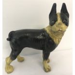A painted cast metal figurine of a French Bulldog.
