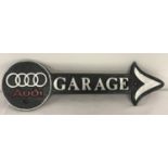 A black, silver and red painted Audi Garage arrow wall hanging sign.