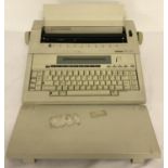 A Brother AX-35 electronic typewriter complete with keyboard cover.