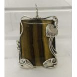 A large rectangular shaped Tiger's eye pendant framed in an Art Nouveau style 925 silver mount.