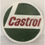 A painted cast metal, circular shaped Castrol wall hanging plaque.