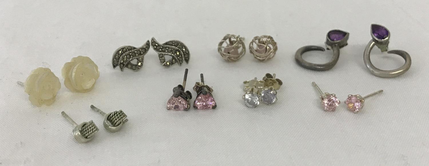 8 pairs of silver stud style earrings, some stone set.