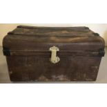 A vintage tin trunk with brass catch.
