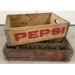 2 vintage wooden Pepsi Cola crates with metal banding; one with individual bottle sections.