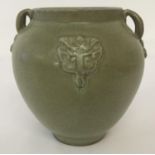 A Chinese porcelain 2 handled pot with matt green celadon glaze.