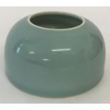 A Chinese porcelain brush washer with duck egg blue glaze.
