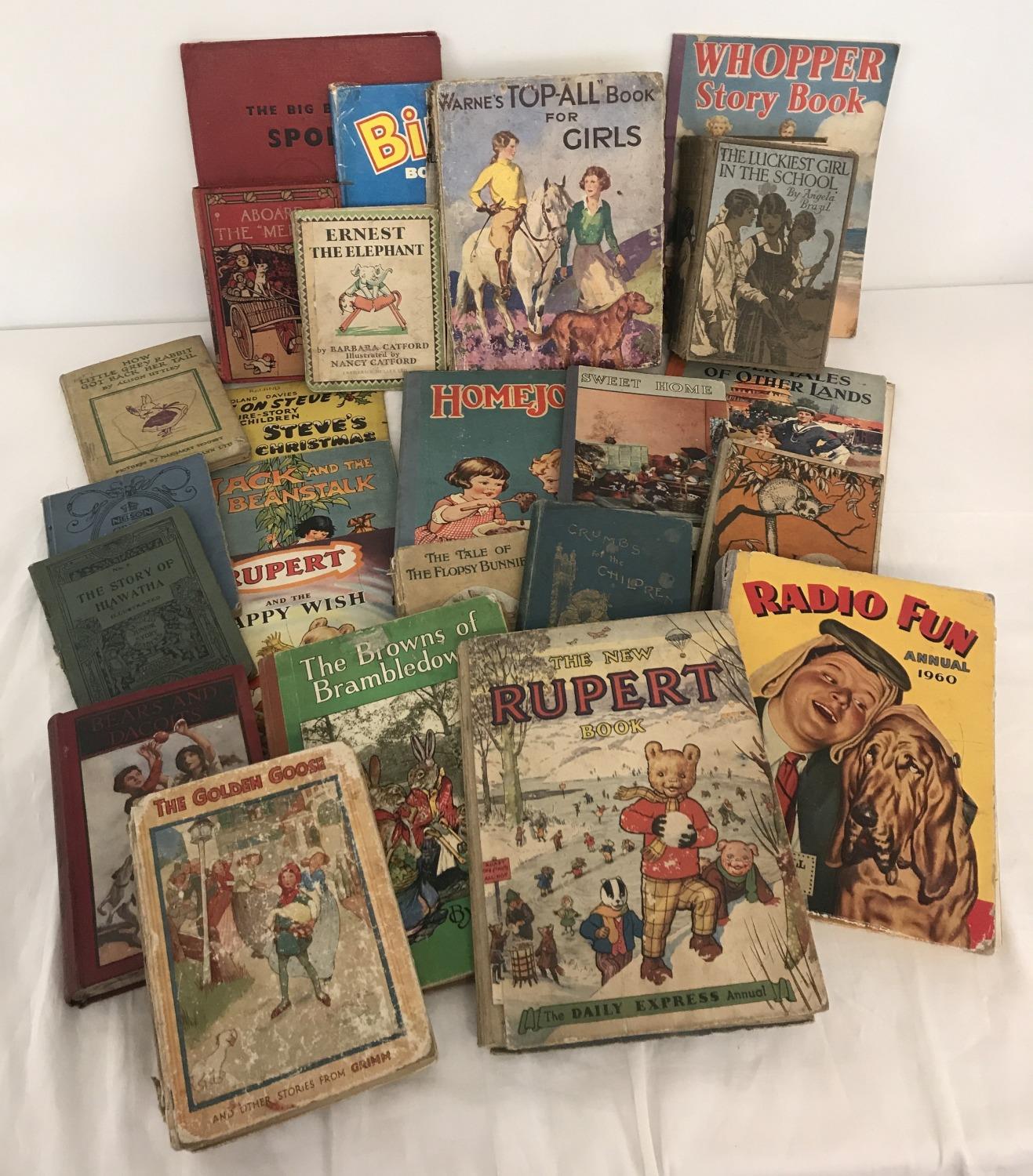 A box of assorted vintage children's books and annuals.