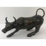 A hollow bronze figurine of a bull.