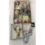 A tray of modern jewellery, some with original cards and packaging.