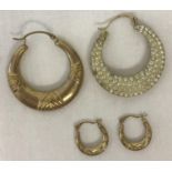 2 pairs of hoops style earrings. A larger pair set with clear stones to one side.