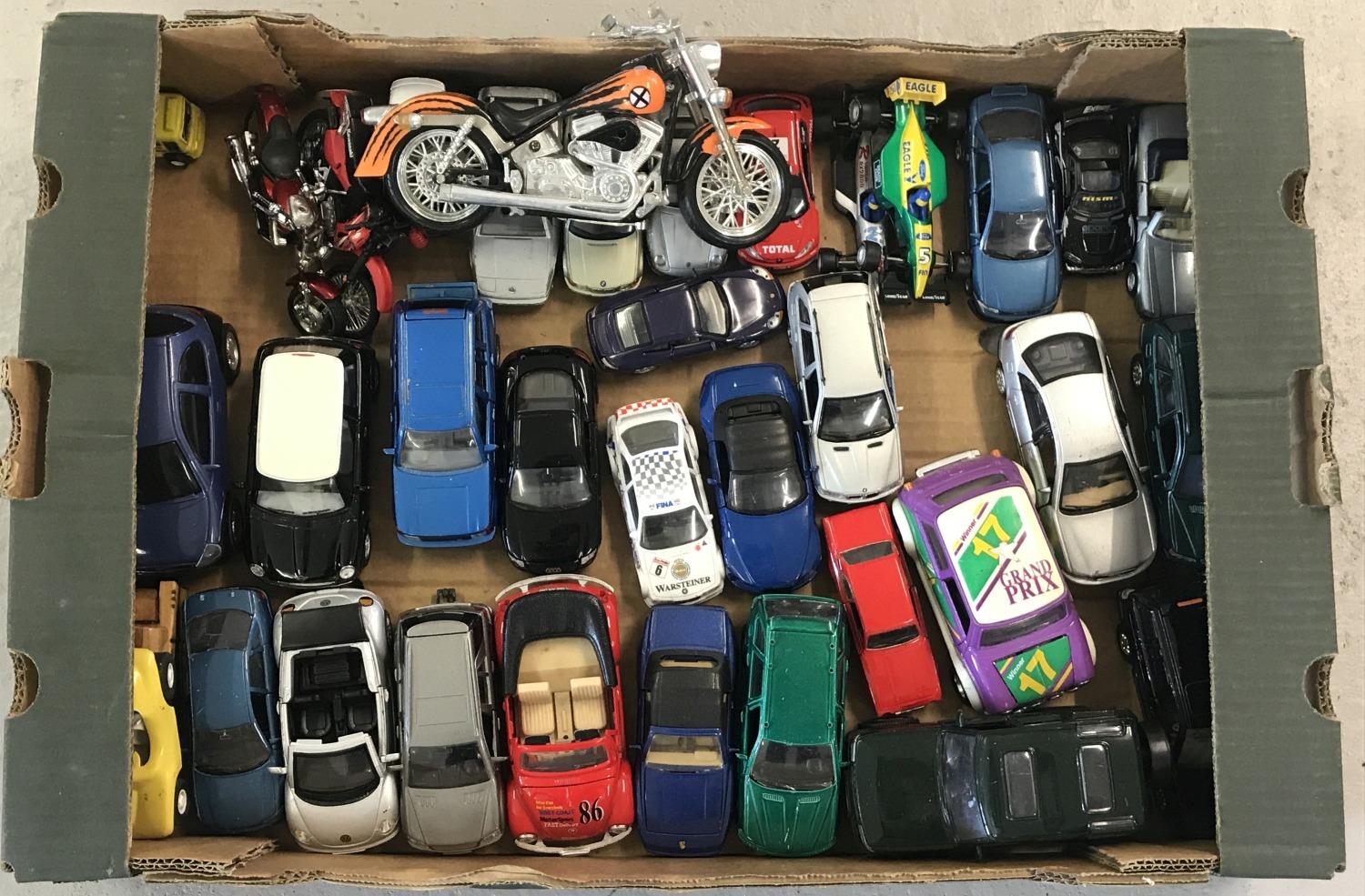 A box of assorted diecast cars, racing cars and motorbikes, in various scales.