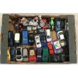 A box of assorted diecast cars, racing cars and motorbikes, in various scales.