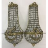 A pair of metal framed heavily beaded empire wall lights.