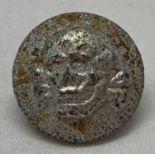 A German WWII style Waffen SS-VT overseas death's head cap button.