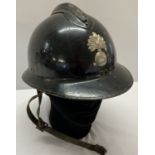 A WWII style French M26 Casque Adriane helmet with liner.
