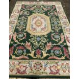 A floral design large rug by Axminster.