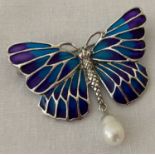 A 925 silver butterfly brooch with coloured translucent enamelled wings and pearl drop pendant.