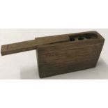 A WWII style German stick grenade primer box with sliding lid.