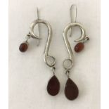 A pair of large contemporary style drop earrings in 925 silver set with cornelian stones.