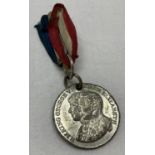 A George VI coronation miniature medal, complete with ribbon.