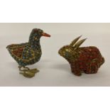 2 small metal animals; a rabbit and a duck, set with coral and turquoise beads.