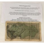 WWII style Nazi propaganda money with information sheet.