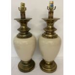 A large pair of heavy brass and cream porcelain lamp bases, with Stiffel stickers to fitments.