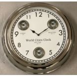 A large modern wall hanging, multi dial, world cities, clock with chrome finish.